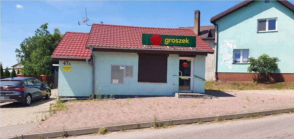 Działka zabudowana budynkiem usługowym (sklep)