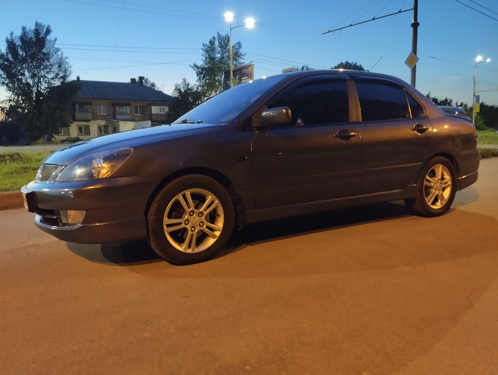 Митсубиси Лансер 9 2л .