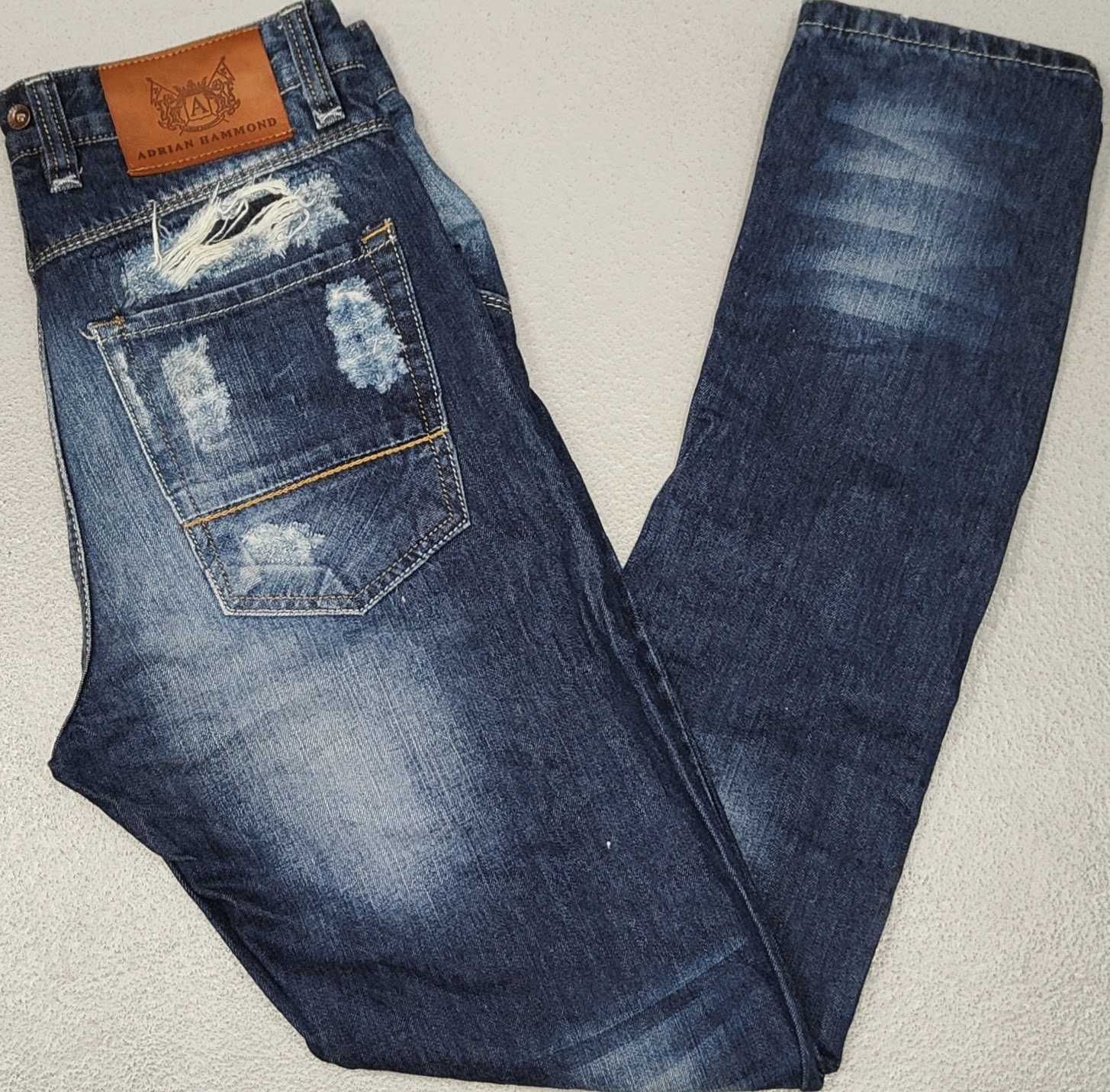 R) ADRIAN HAMMOND męskie spodnie jeansowe z dziurami Roz.33