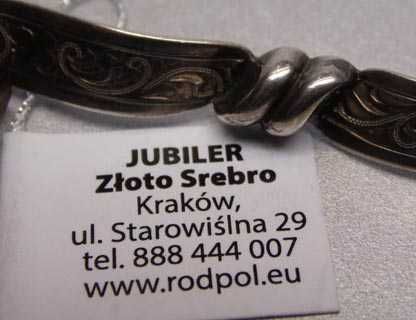 Przedwojenna srebrna broszka grawerowana kokarda Teka.