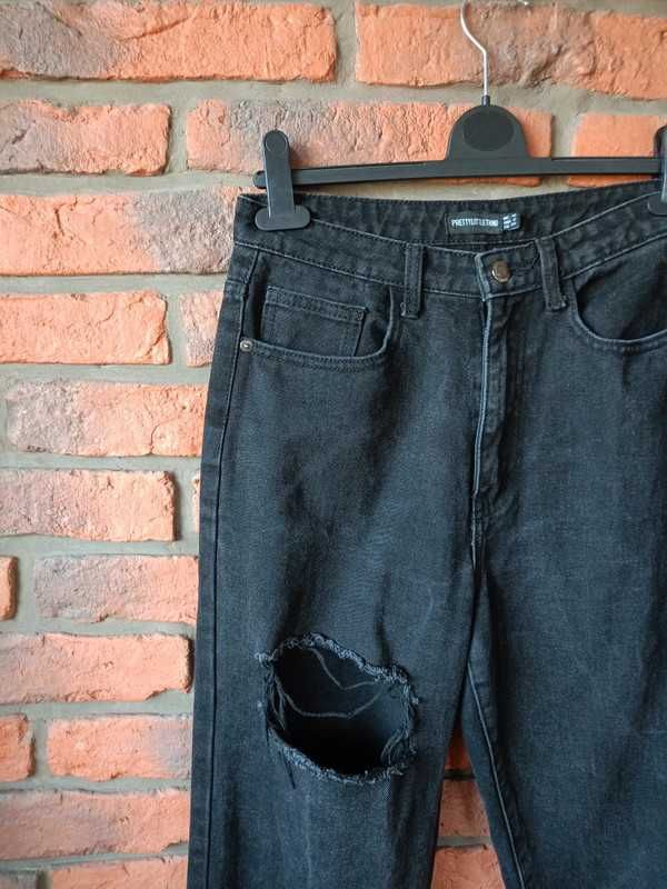 Spodnie damskie czarne z dziurą jeansy