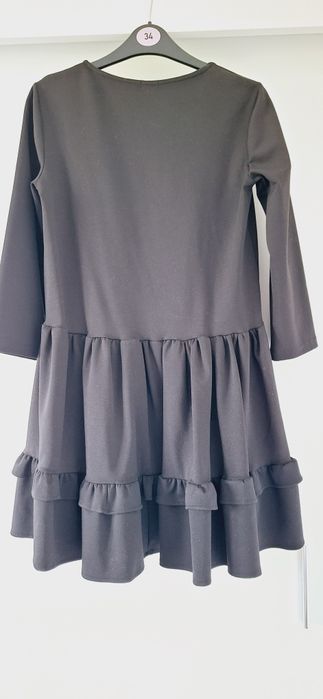 Varlesca elegancka czarna sukienka z falbanką