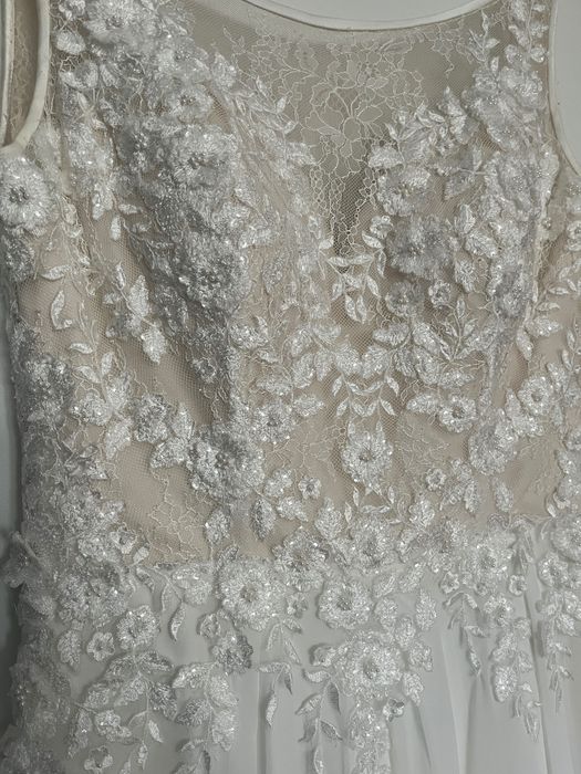 Suknia ślubna z salonu z wyciętymi plecami rozmiar 36/8