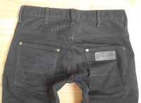 Ciemno brązowe spodnie męskie jeans Wrangler Spencer W28L34