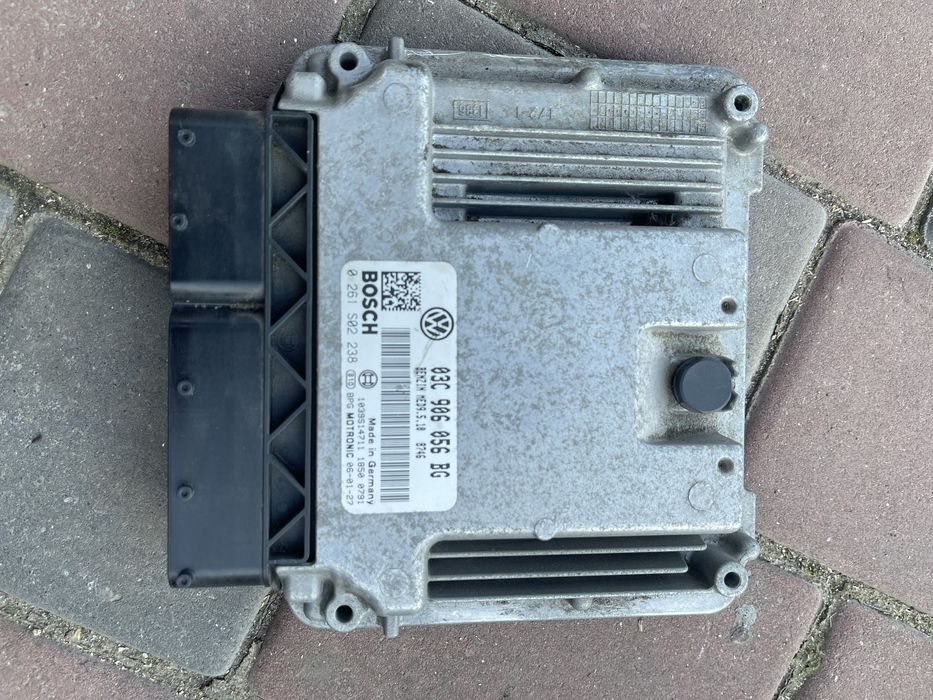 Блок керування двмгуном гольф 5 1,4  125 кв