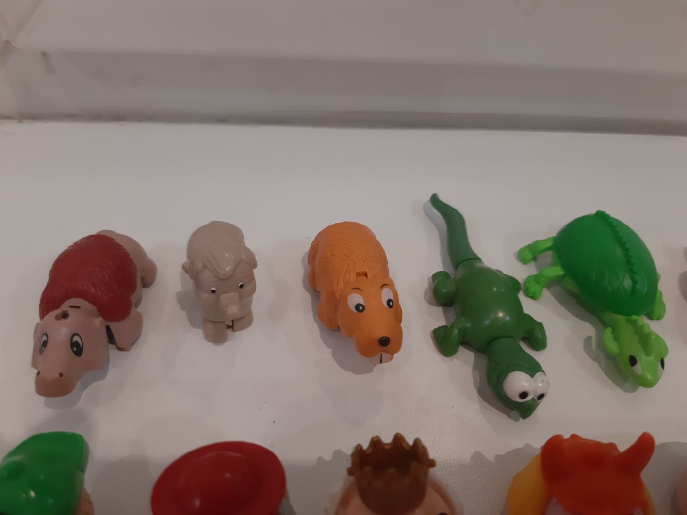Игрушки с киндера дракончики,головы,слоник,сова,черепаха и другие