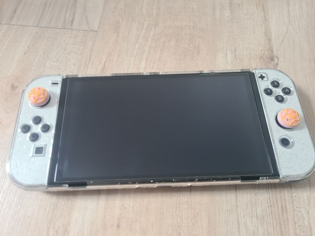 Nintendo switch oled+2etui+Pad 8bitdo+2joycony+ładowarka na 4joycony