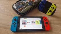 Consola Nintendo Switch e vários acessórios