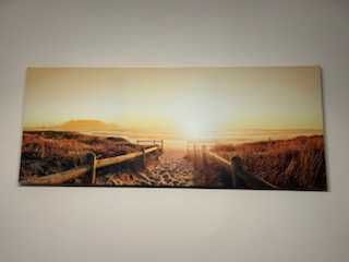 Obraz 150x60cm.Piękny wschód słońca nad morską plażą