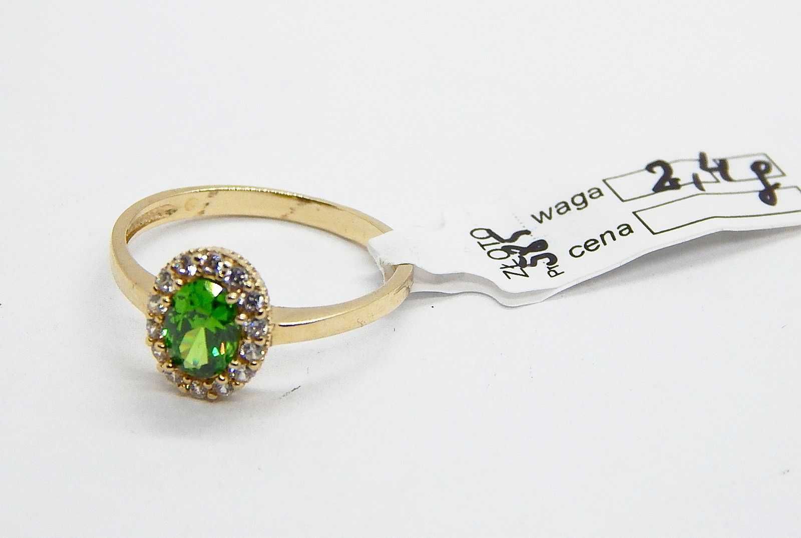 Złoty pierścionek z zielonym oczkiem złoto pr. 585 waga 2,4 g roz. 18