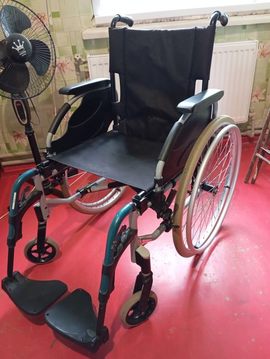 Инвалидная коляска .