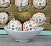 Пуєр в мандаринк чай Синьхуэй Сяоцинган в мандаринке