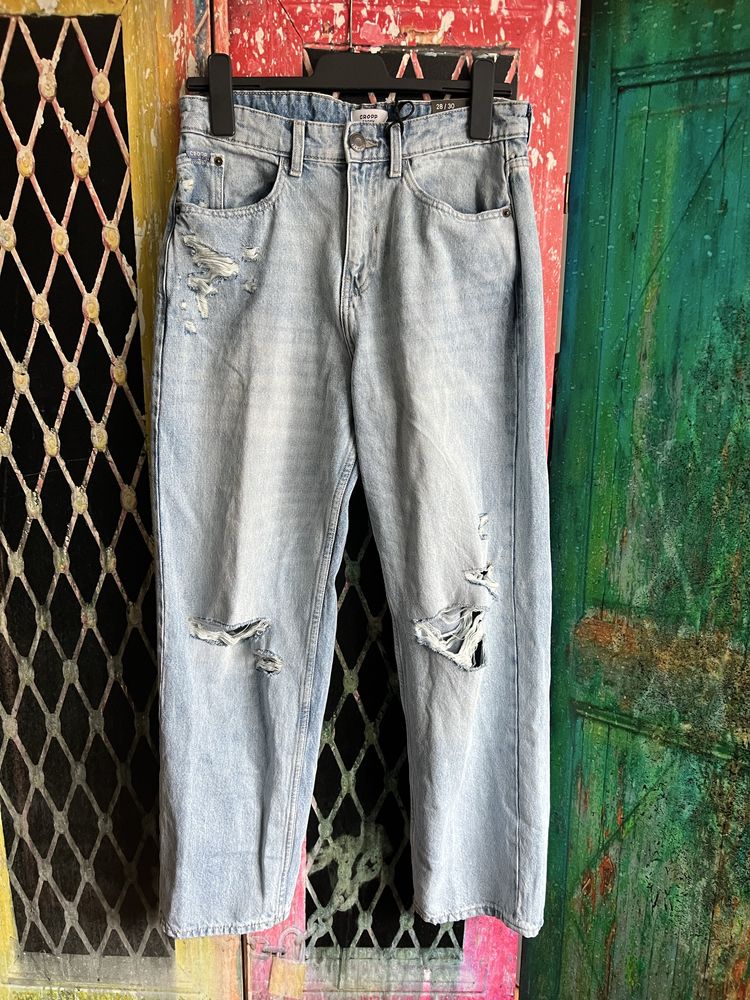 Spodnie jeansowe z dziurami przetarciami denimowe jeansy baggy Cropp