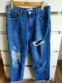 Spodnie z dziurami jeansy