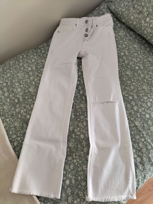 Calças brancas a boca de sino Novas Mango