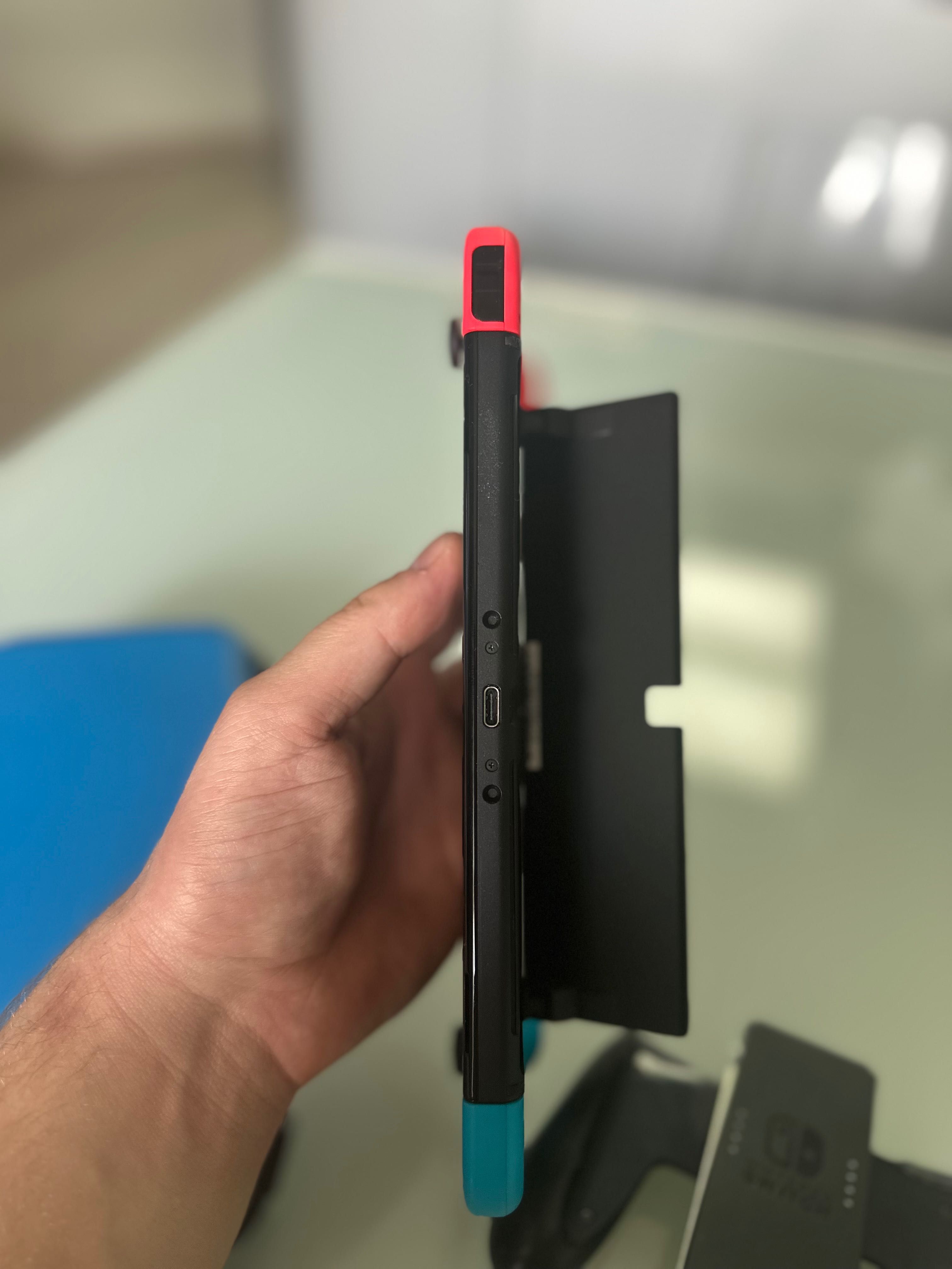 Nintendo Switch OLED with Neon Blue and Neon Red Joy-Con