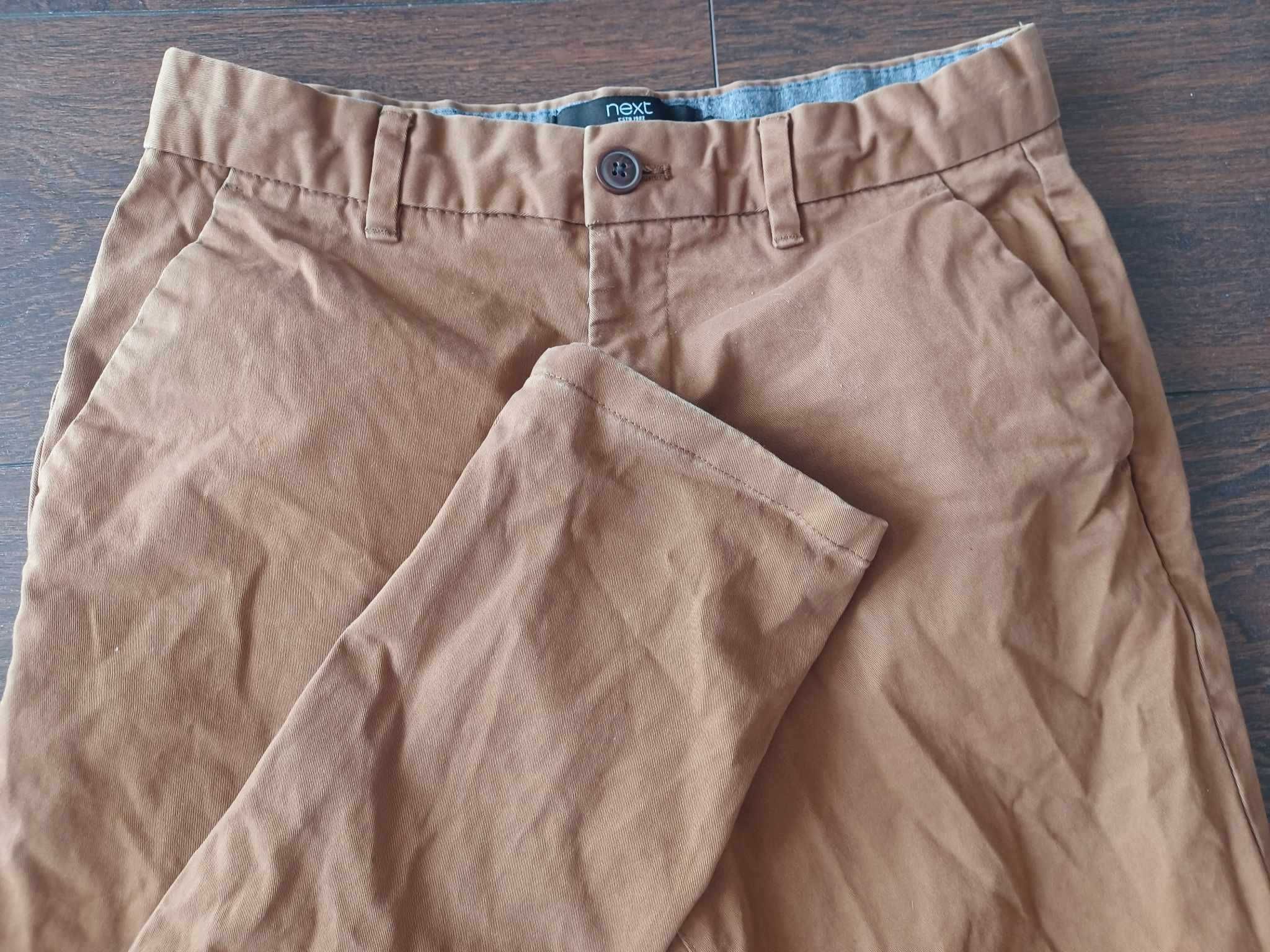 Długie bawełniane spodnie męskie NEXT 30 (S/M) slim fit / musztardowe