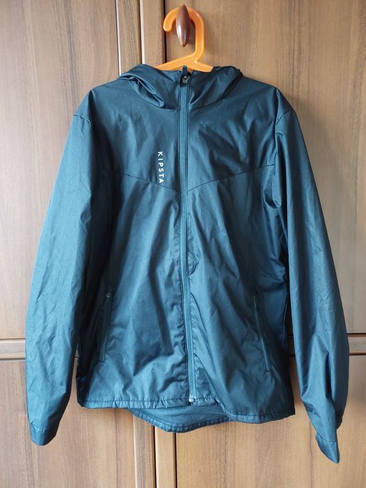 Kurtka przeciwdeszczowa, wiatrówka z kapturem Kipsta r. 140/152. 1500