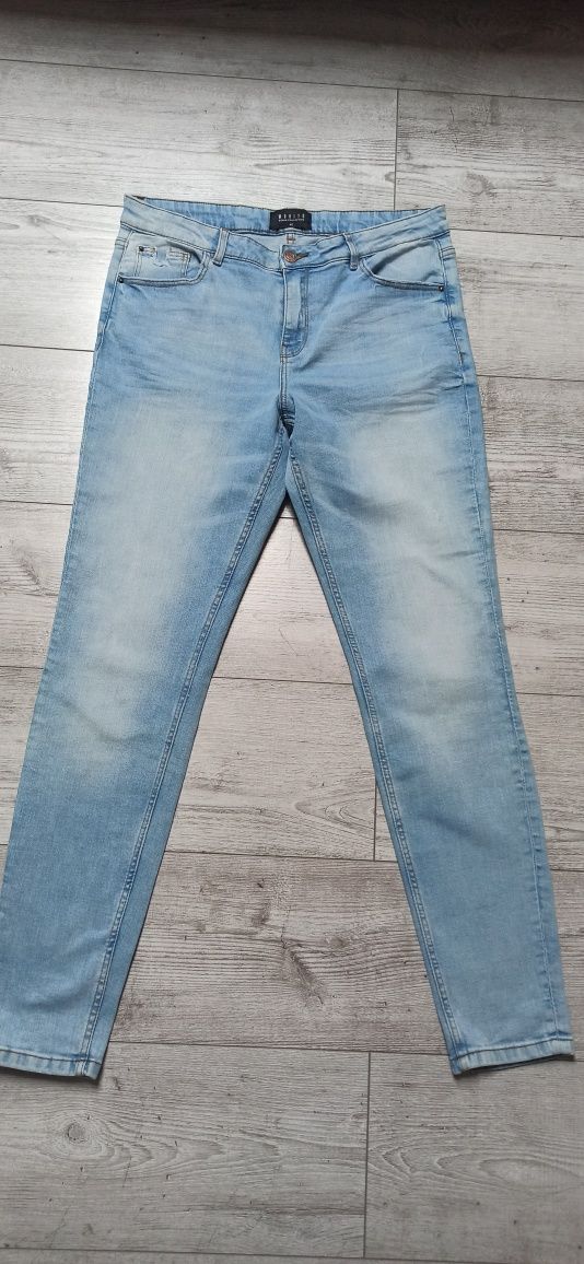 Spodnie jeansy damskie Mohito rozm. 42