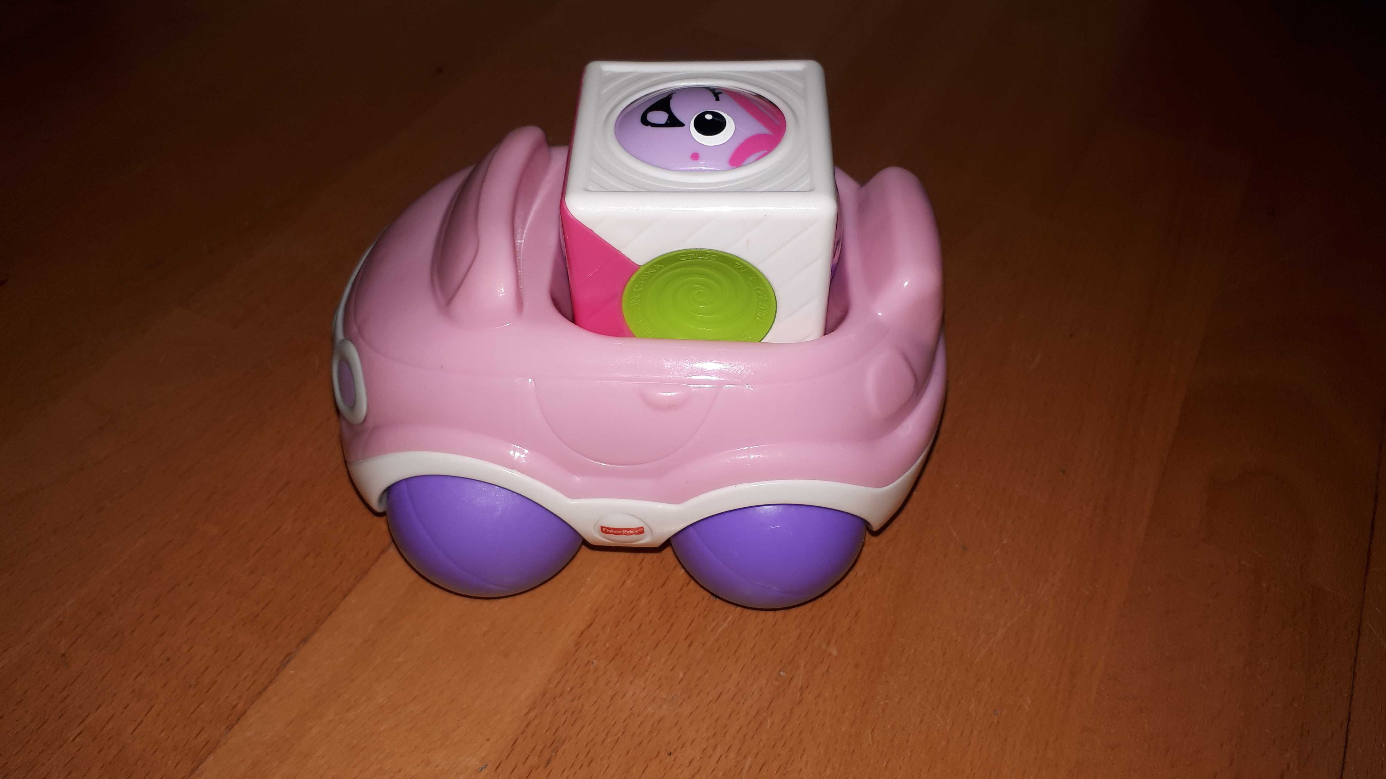 Różowe autko firmy Fisher-price