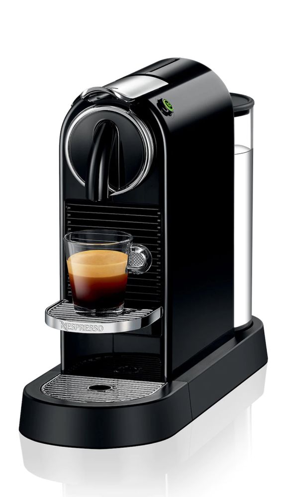 Maquina nexpresso e caixas de café