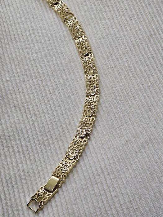 Bransoletka ażurowa kwistki z cyrkoniami stylizowana na Apart kolor zł