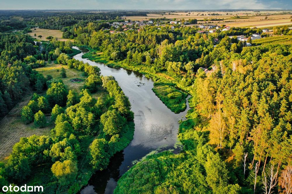 Działka budowlana 1202 m² ogrodzona, media, na wzniesieniu nad Wkrą