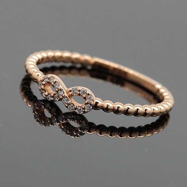 Złoty pierścionek z diamentami nieskończoność różowe złoto 14K