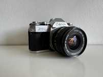 Canon AT-1 28mm f2.8 S.C - aparat analogowy, osłona, pasek, filtr