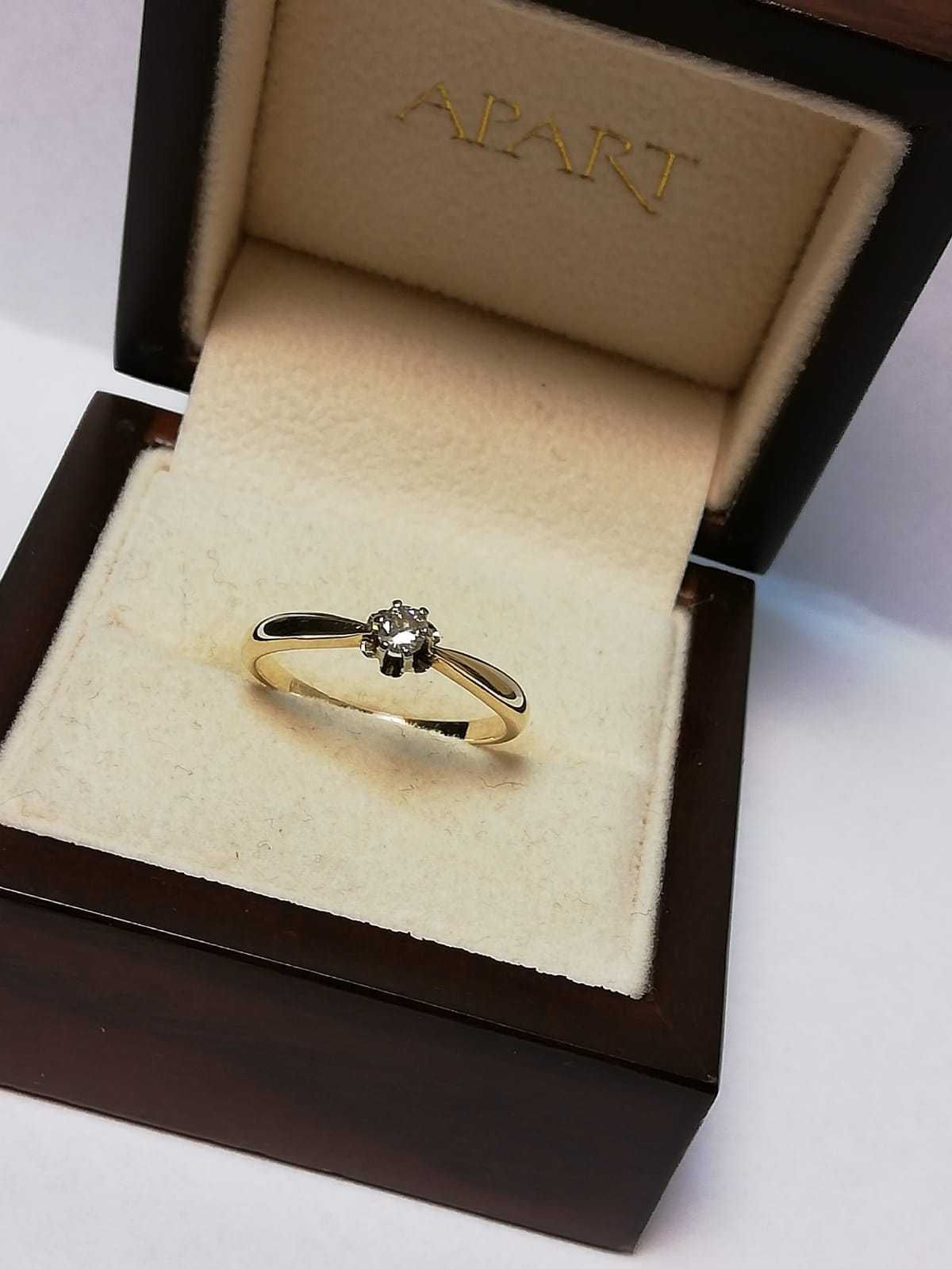 Złoty pierścionek z brylantem 0,15ct/pr.585/1.8g/r.14