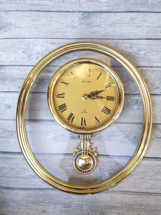 Rhythm часы настенные с маятником.
