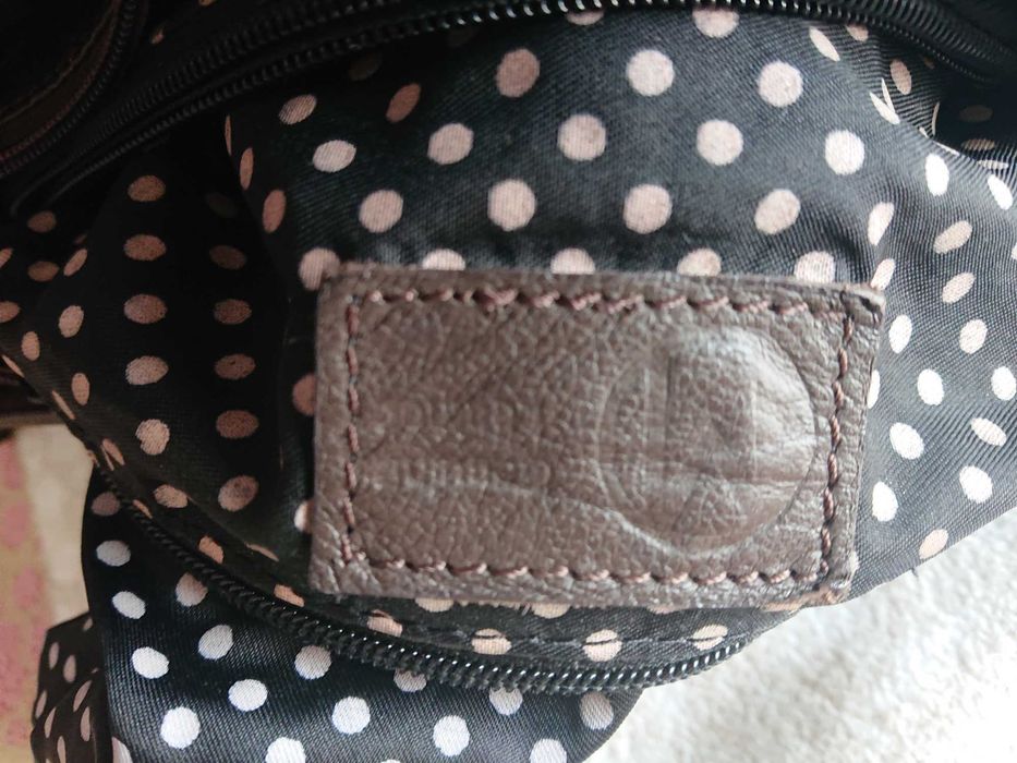 Mala castanha em pele