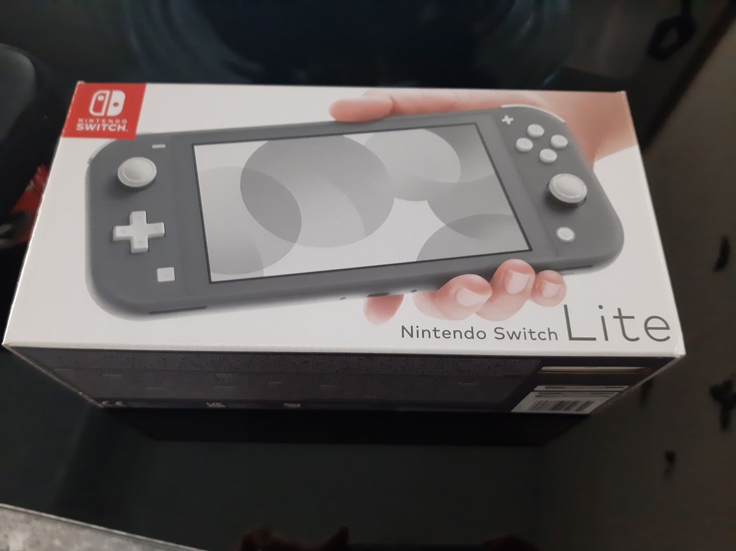 Nintendo switch Lite + bolsa original + 2 jogos