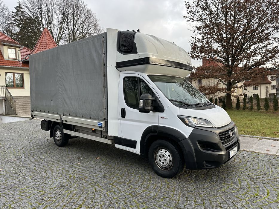 Wynajem Fiat Ducato 2.3 diesel Maxi 180 koni plandeka 9 palet.