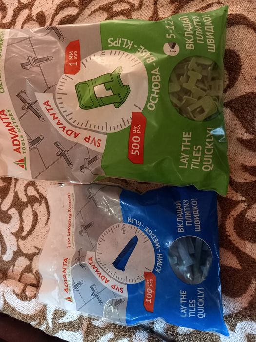 Система вирівнювання плитки