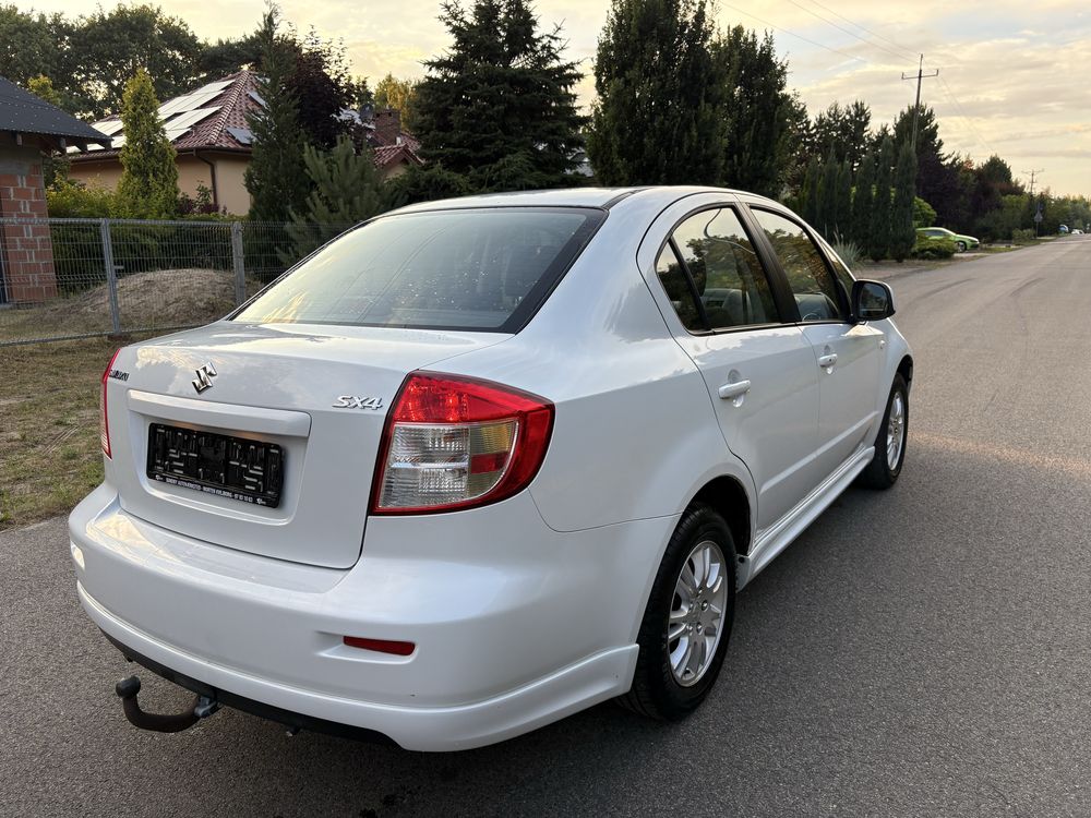 Suzuki sx4. Klimtronic biala perla
