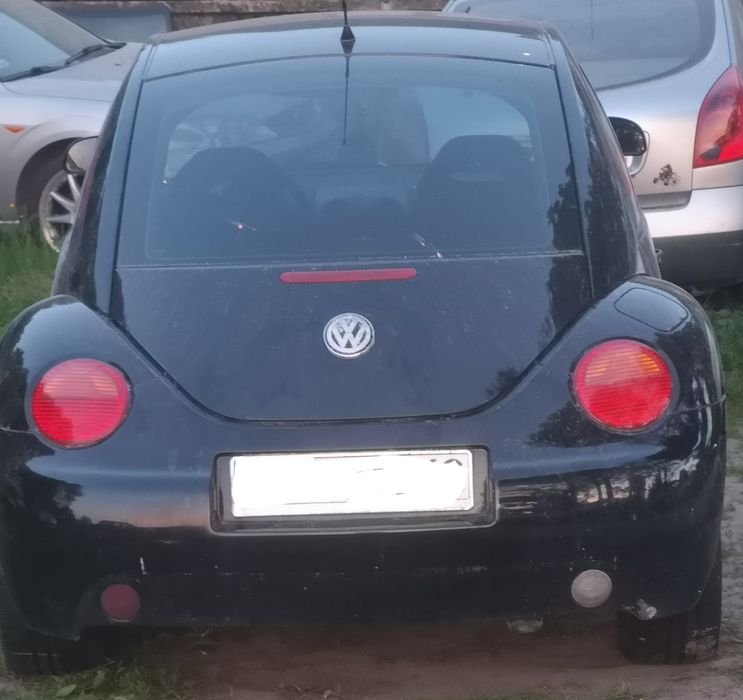 VW New Beetle części od a-z mocowanie okular lampy prawy przód  orygin