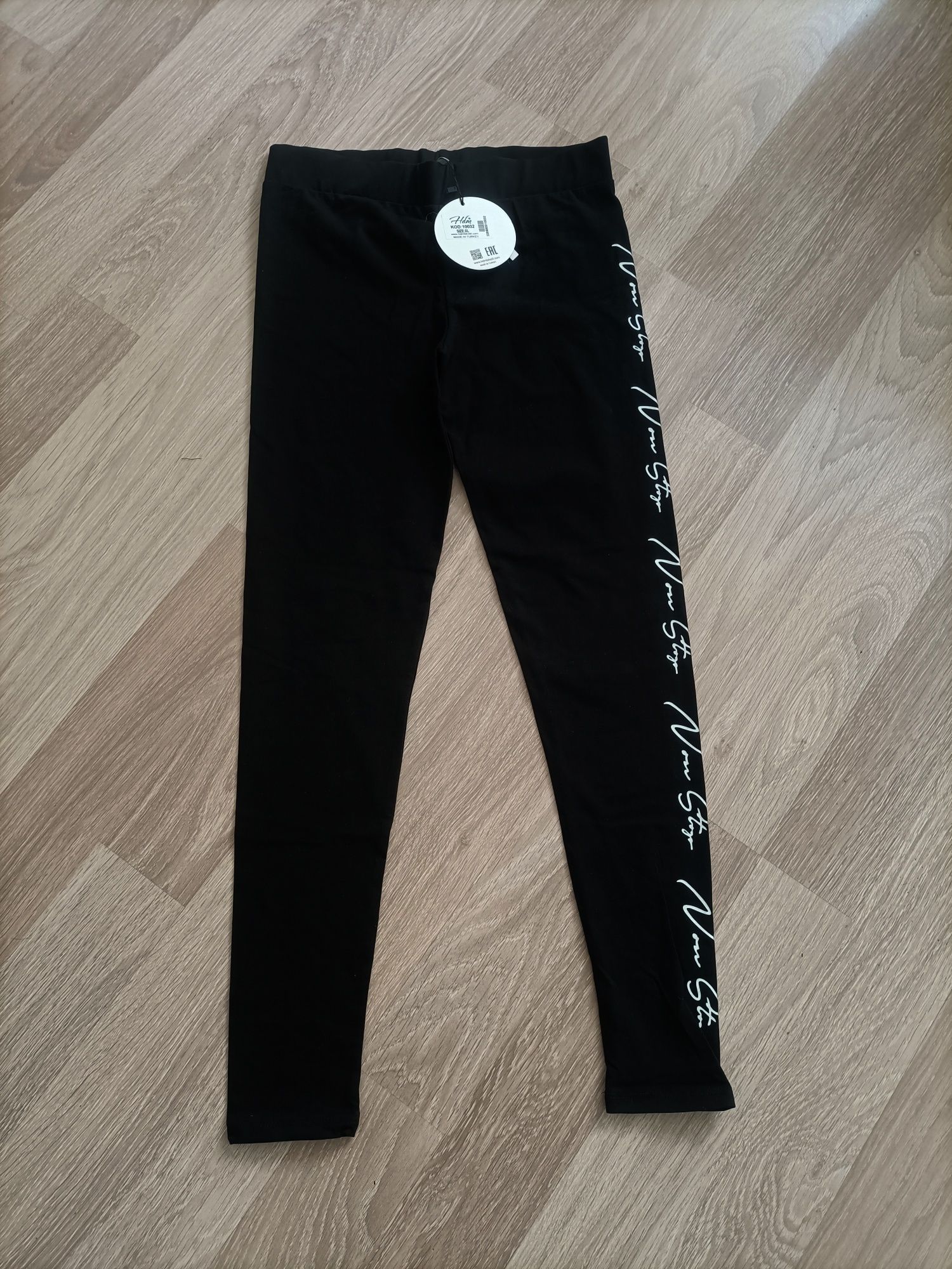 Nowe legginsy damskie z napisem po boku rozmiar XL