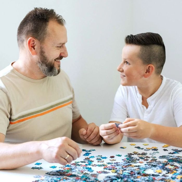 Puzzle 1500 el. Świąteczna wioska – Wiara, która trwa