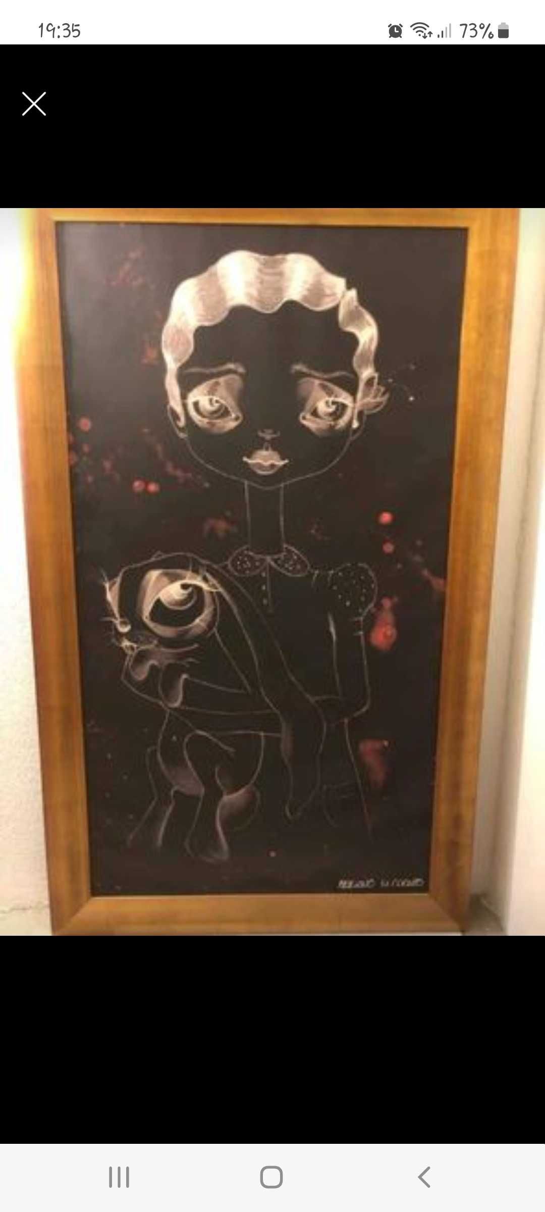 Quadro com modura em dourado