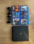 PS4 Pro + 2 pady + zestaw gier