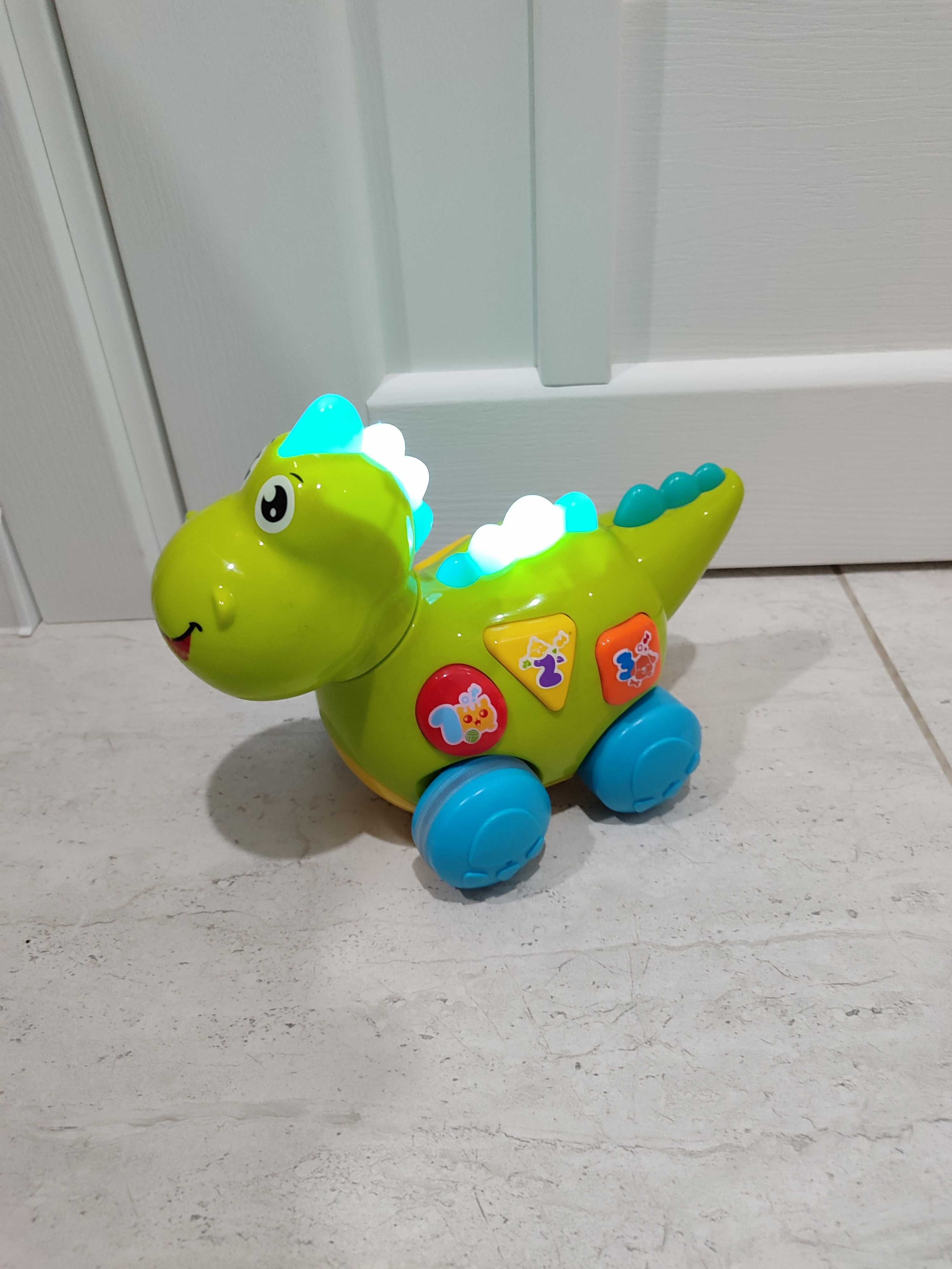 Музична іграшка Динозаврик "Huile Toys" їздить, розмовляє, співає
