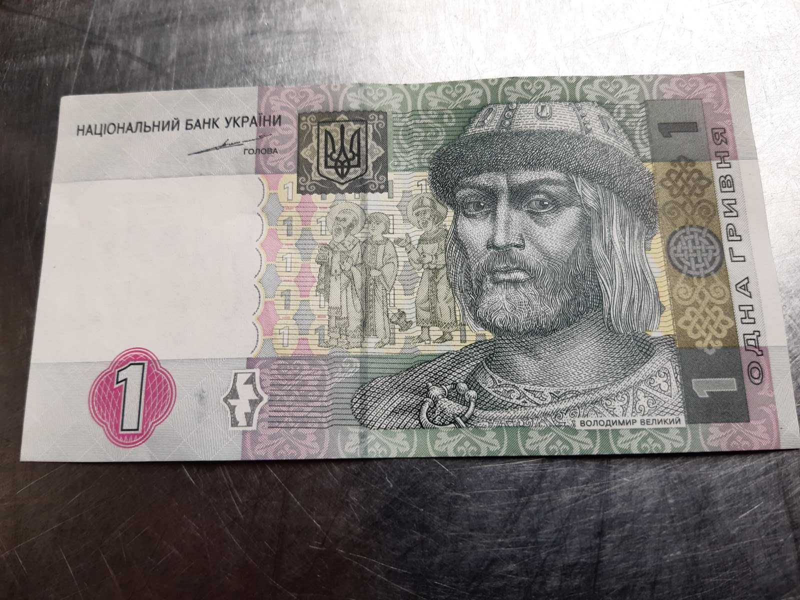 1 гривня 2004 року С. Тігіпко