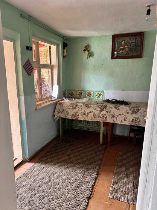 Частина будинку з ділянкою