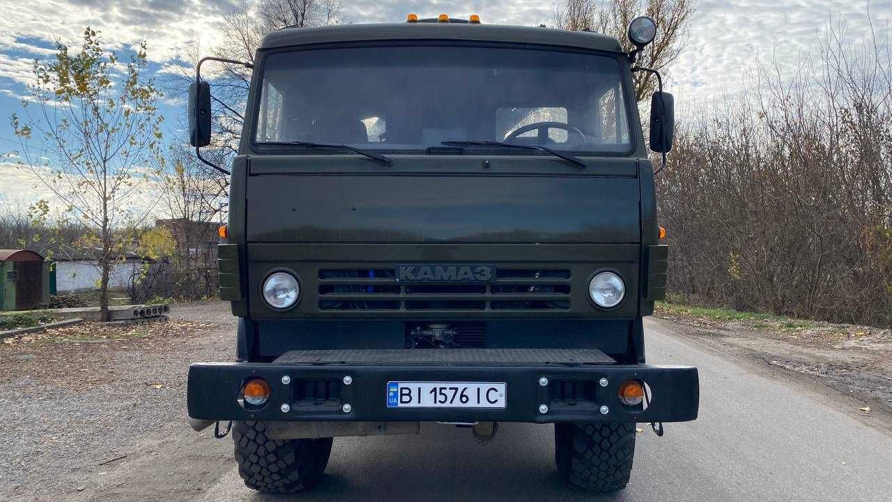 КАМАЗ 4310, бортовий з маніпулятором