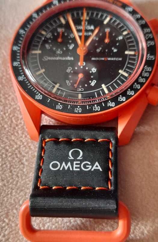 Omega Swatch SO33O100 Lava Archiwum Ziemi