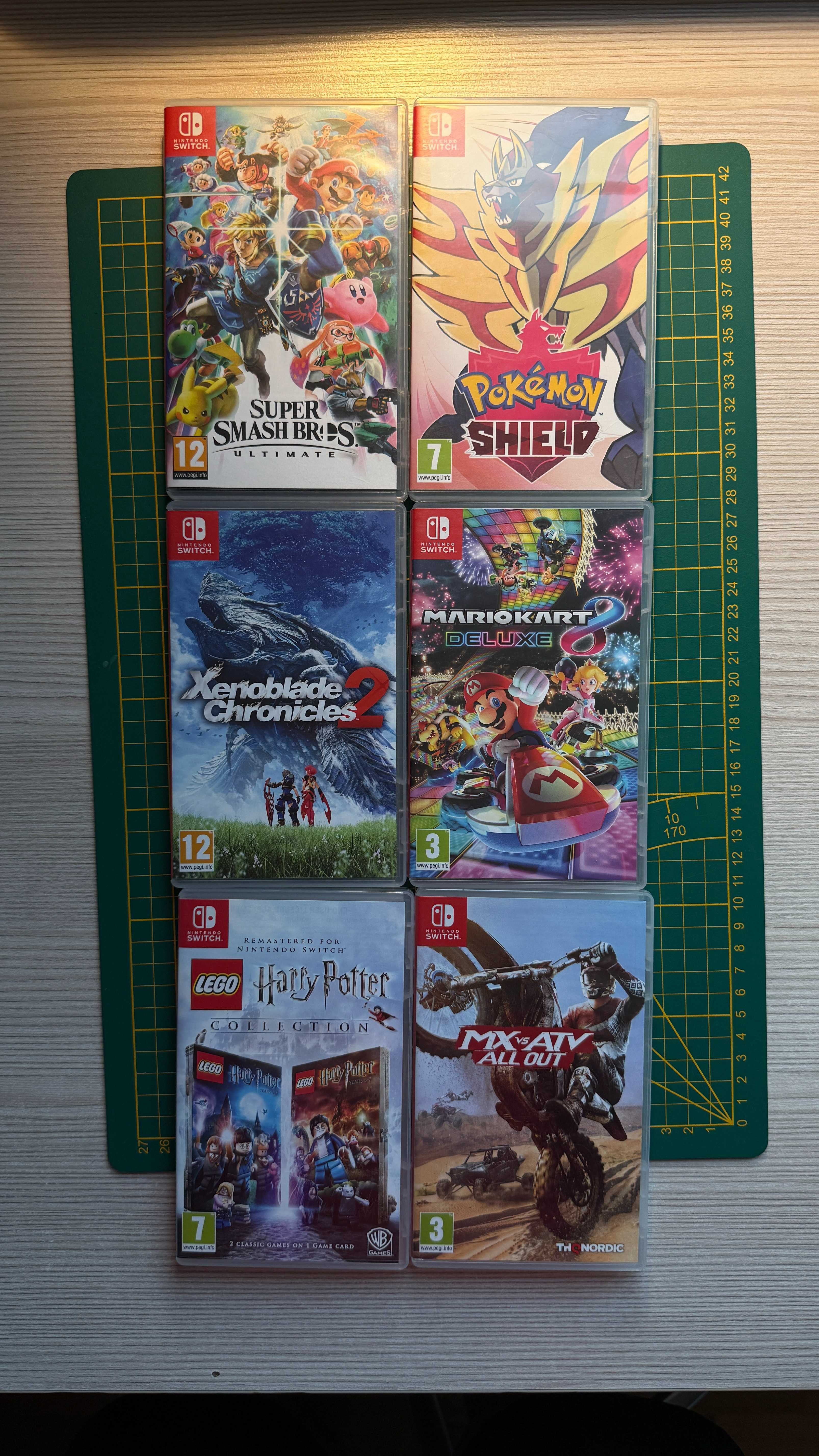 Nintendo Switch + gry (Mario Kart 8, Smash Bros., Pokemon Shield itp.)