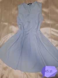 Błękitna sukienka z kokardkami Mohito M/

34