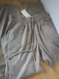 Nowe spodnie damskie 36 S beżowe z dzianiny nowa kolekcja