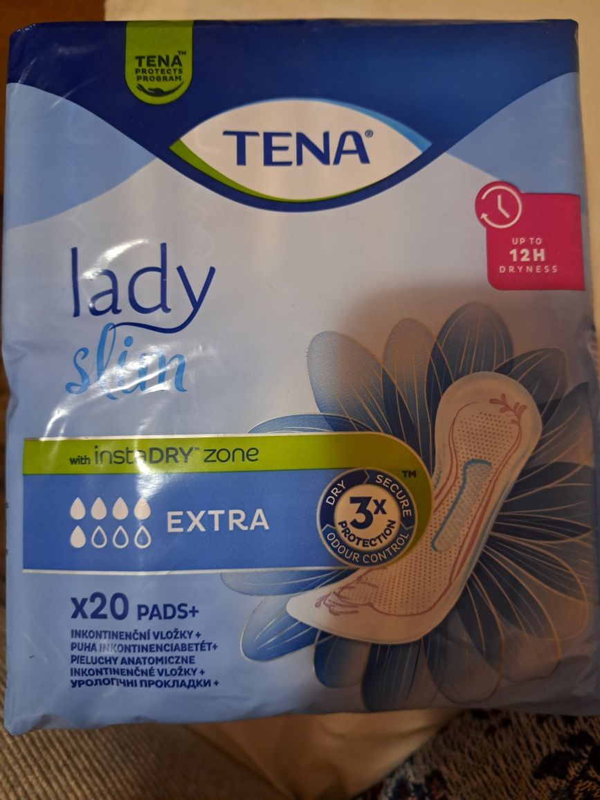 Tena . Жіночі прокладки.
